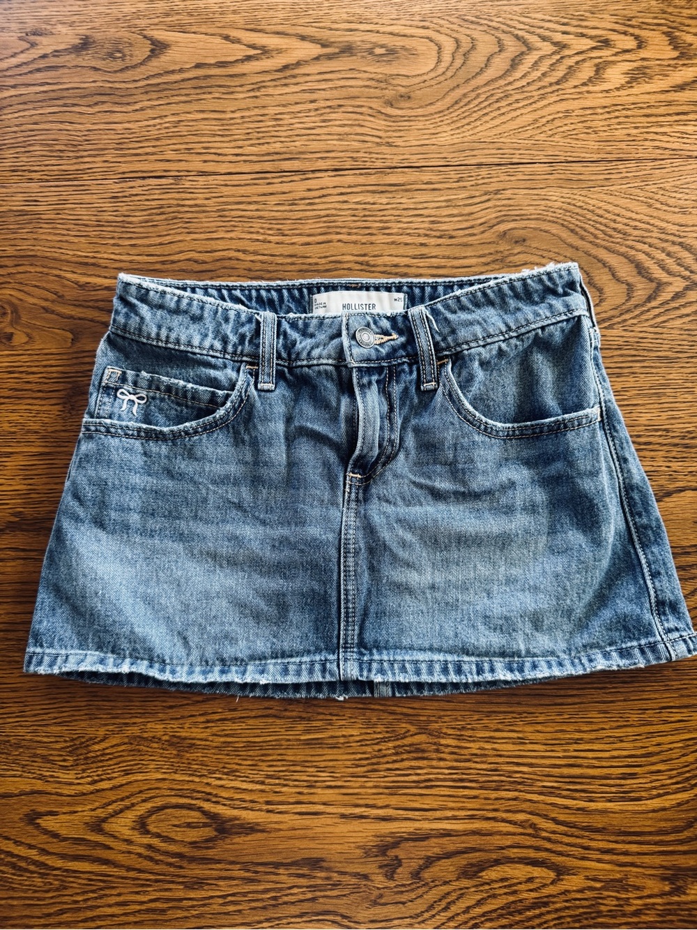 Hollister Blue Denim Mini Skirt with Pink Bow Accents and Built-In Shorts